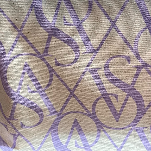 Victoria Secret bag with some beauty products is side - Picture 4 of 9